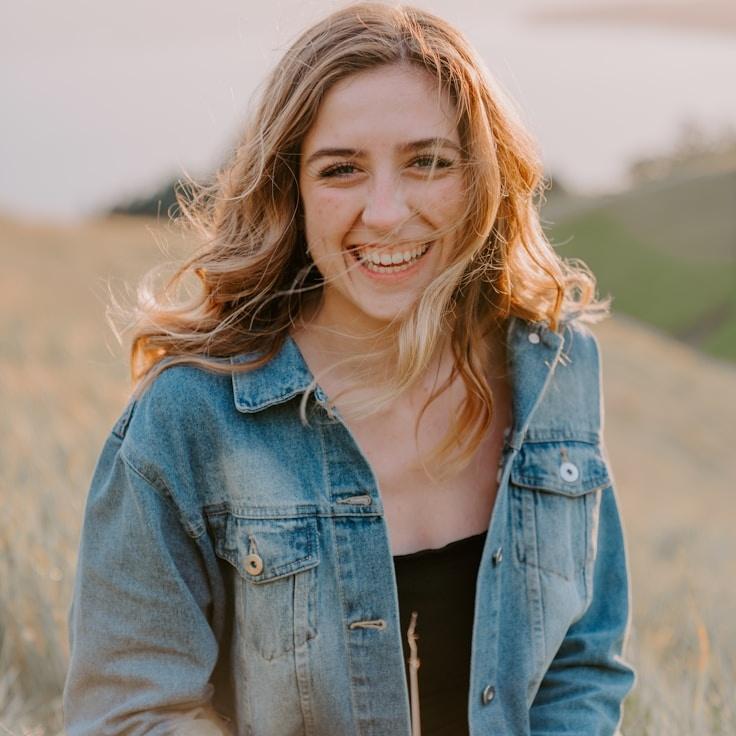 Alex Kim, Lead Design Curator at Trail Stone Haven, reviewing corporate floral arrangements